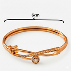 Elegant Infinity Knot Bracelet with American Diamonds (Gold Finish)